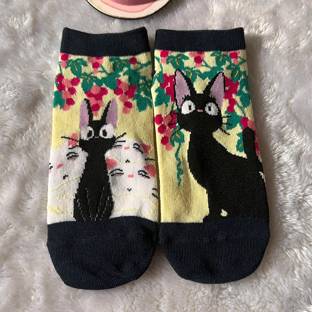 A playful low-cut sock pair with a cartoon cat design for everyday comfort and gifting.