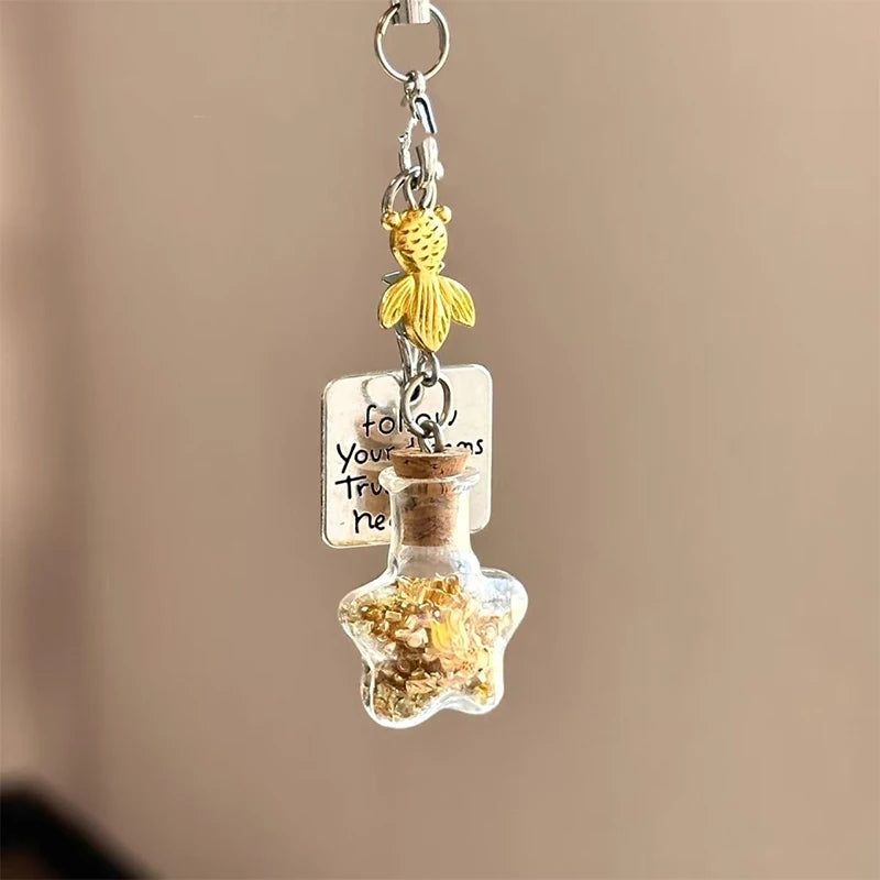 A cute decorative charm for phones, handbags, backpacks, keys, and everyday accessories.