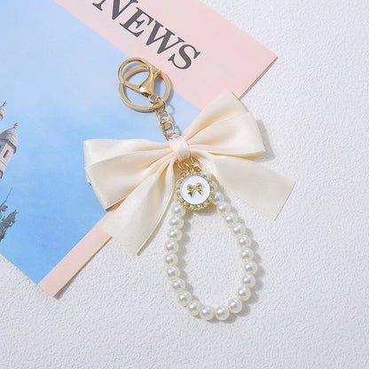 A stylish decorative charm for handbags, backpacks, headphone cases, and everyday accessories.
