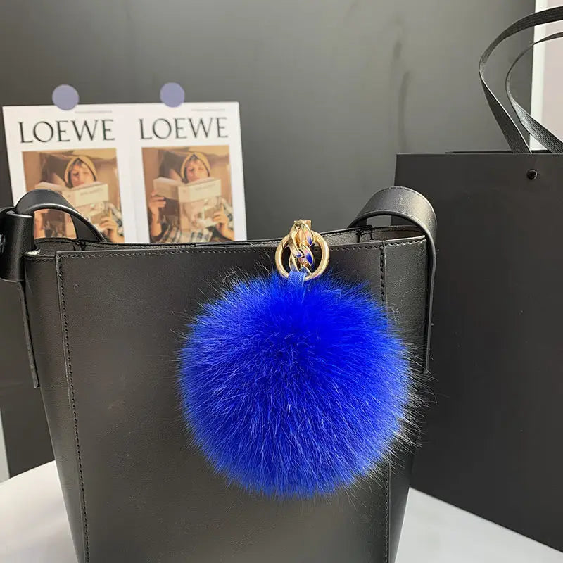 A stylish accessory for handbags, backpacks, keys, and everyday fashion.