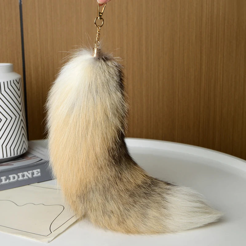 A playful fur tail bag charm for handbags, backpacks, keys, luggage, and everyday styling.