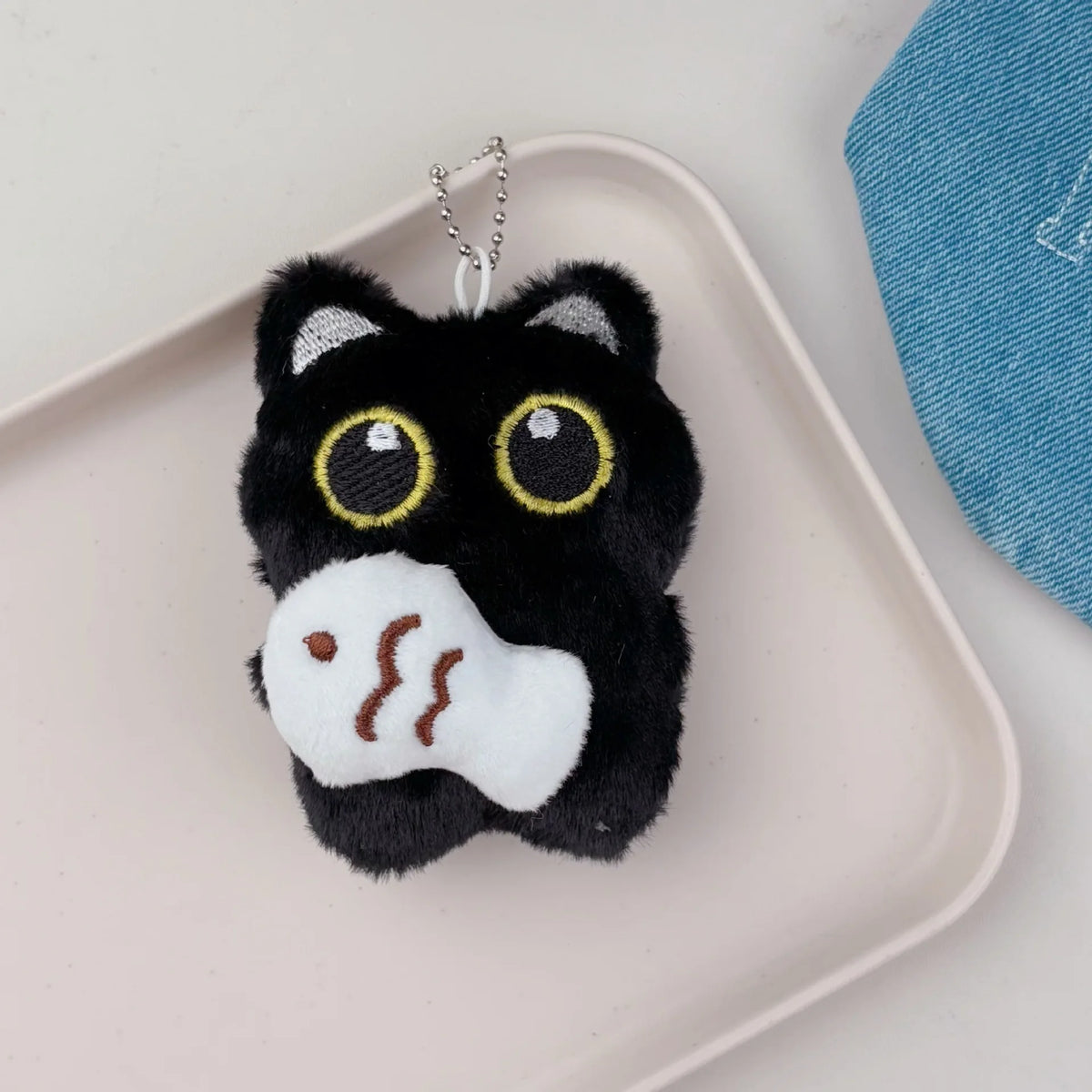 A cute plush accessory for bags, backpacks, car keys, and matching gifts.