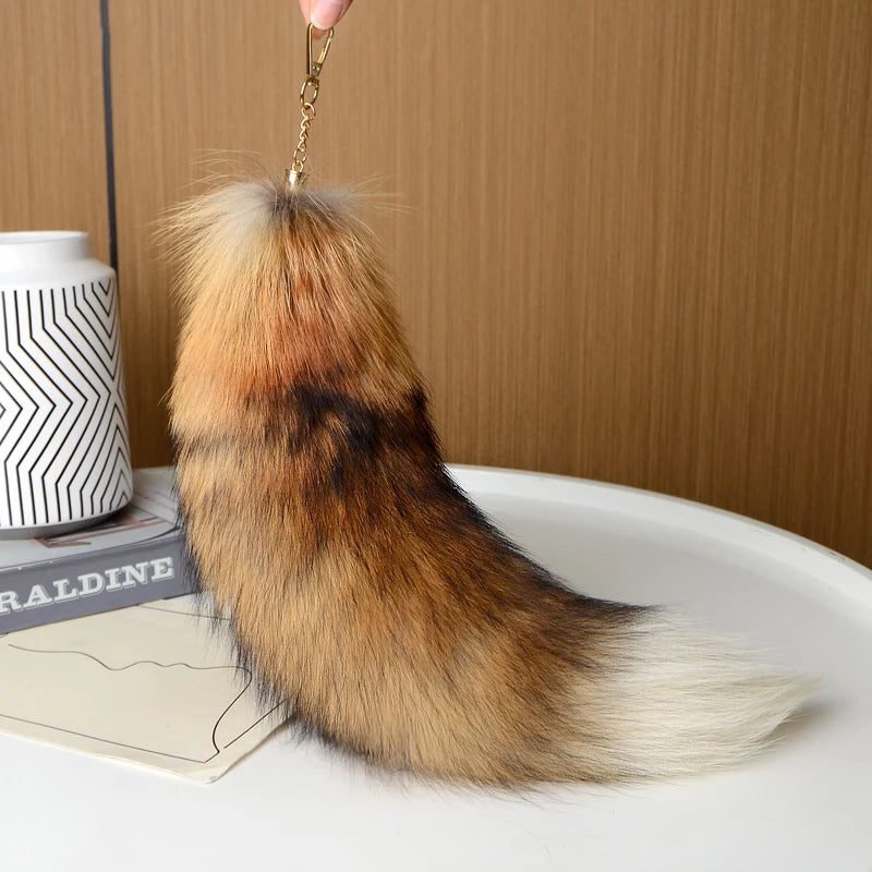 A playful fur tail bag charm for handbags, backpacks, keys, luggage, and everyday styling.
