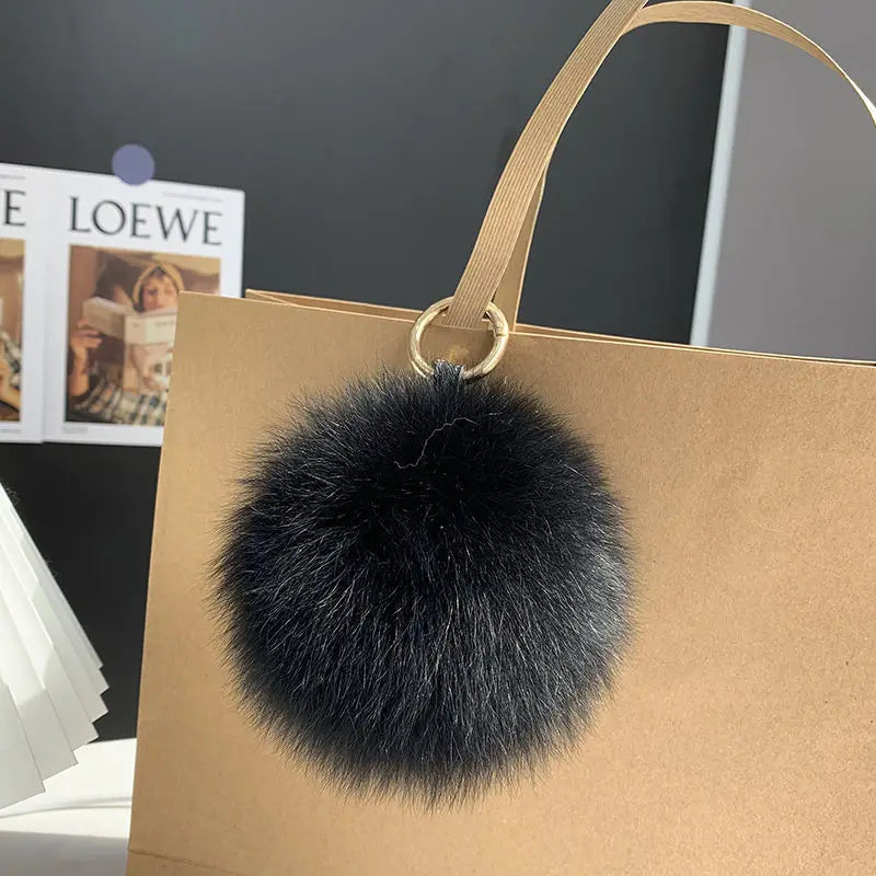 A stylish accessory for handbags, backpacks, keys, and everyday fashion.