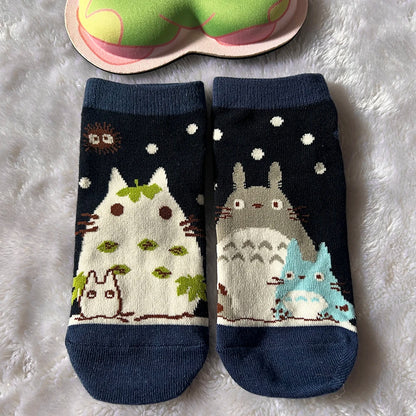 A playful low-cut sock pair with a cartoon cat design for everyday comfort and gifting.