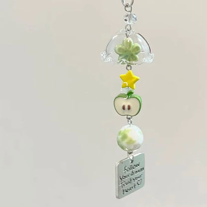 A cute decorative charm for phones, handbags, backpacks, keys, and everyday accessories.