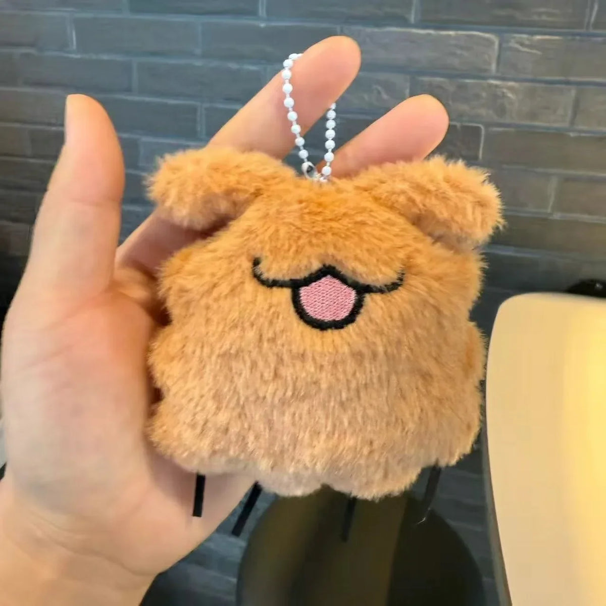 A soft collectible accessory for bags, backpacks, keys, and playful everyday gifting.