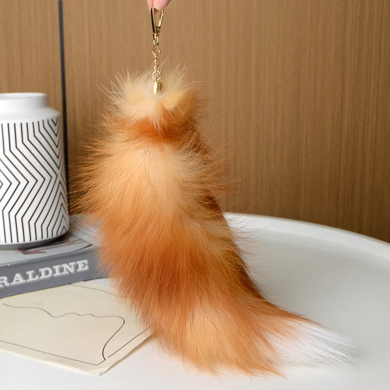 A playful fur tail bag charm for handbags, backpacks, keys, luggage, and everyday styling.