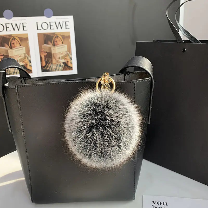 A stylish accessory for handbags, backpacks, keys, and everyday fashion.