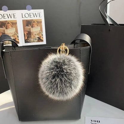 A stylish accessory for handbags, backpacks, keys, and everyday fashion.