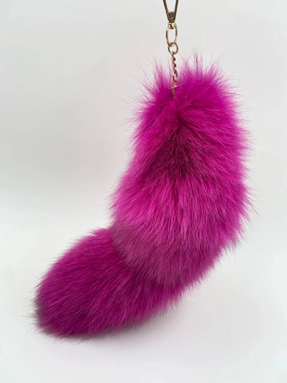 A distinctive bag charm for adding a playful animal-inspired accent to handbags, backpacks, and key sets.