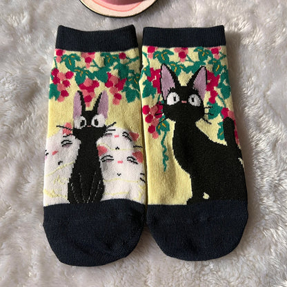 A playful low-cut sock pair with a cartoon cat design for everyday comfort and gifting.