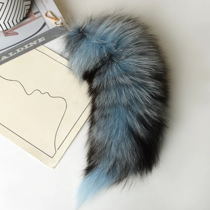 A playful fur tail bag charm for handbags, backpacks, keys, luggage, and everyday styling.