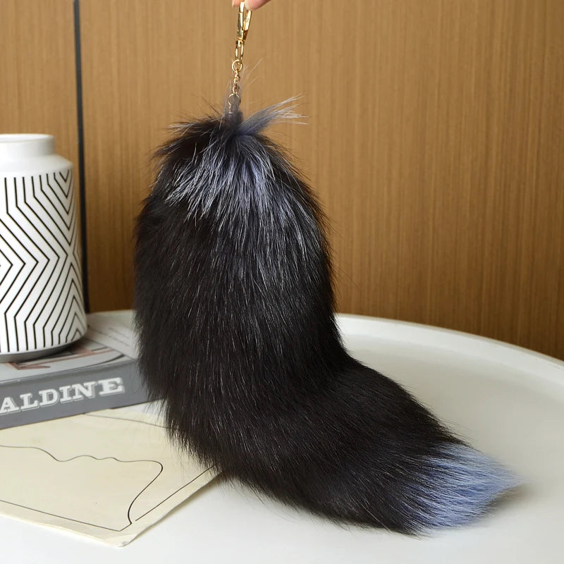 A playful fur tail bag charm for handbags, backpacks, keys, luggage, and everyday styling.
