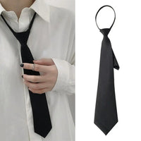 A sleek narrow tie designed to add a polished touch to casual, school, office, and special-event outfits.