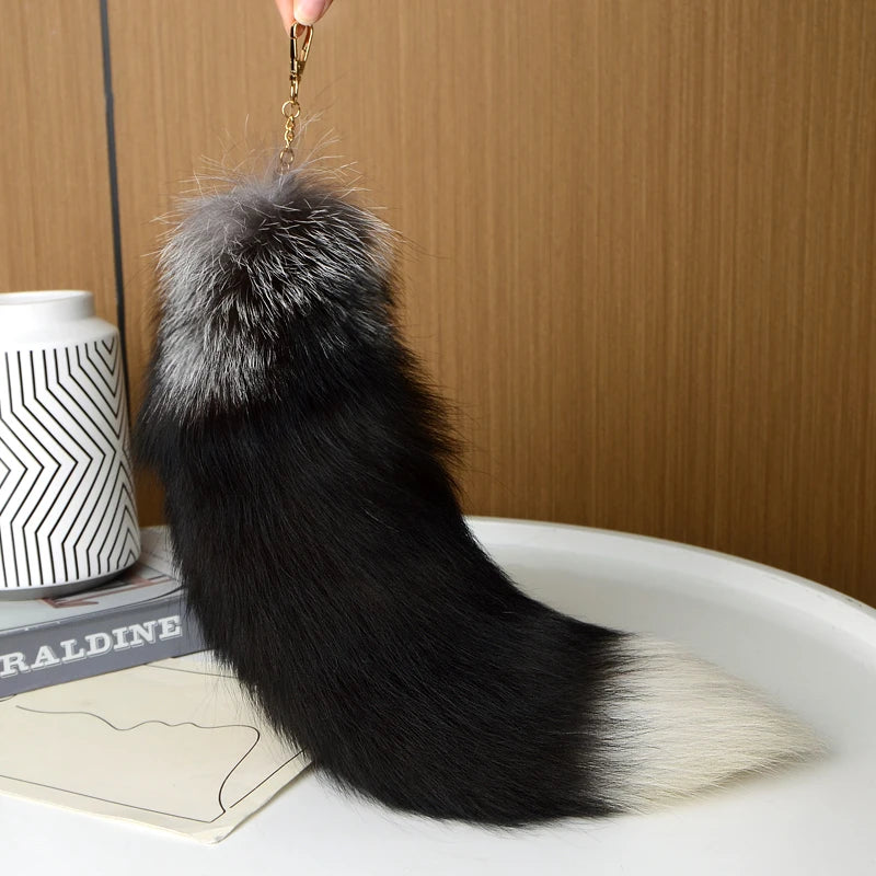 A playful fur tail bag charm for handbags, backpacks, keys, luggage, and everyday styling.