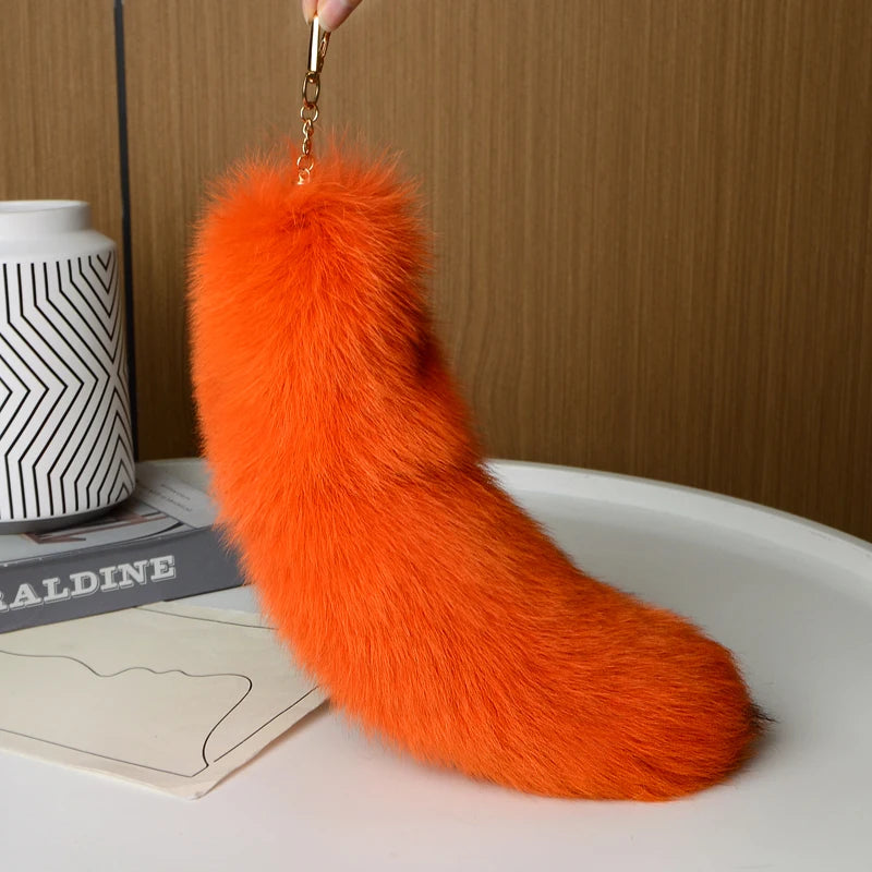 A playful fur tail bag charm for handbags, backpacks, keys, luggage, and everyday styling.