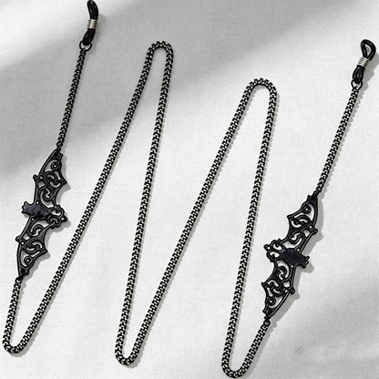 A stylish eyewear accessory designed to keep glasses close while adding a distinctive decorative touch.