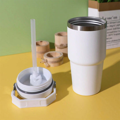 A portable stainless steel tumbler with a convenient handle for travel, work, commuting, and everyday hydration.